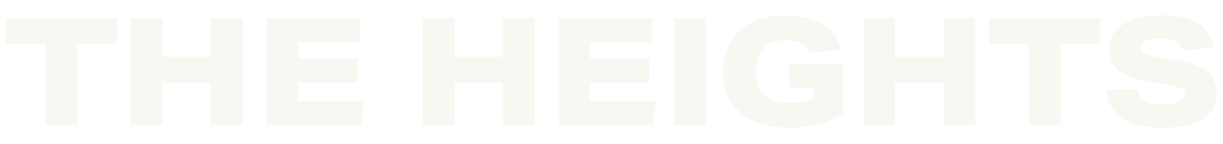 Large, bold, white letters spelling THE HEIGHTS on a light gray background, making the text difficult to read due to low contrast.