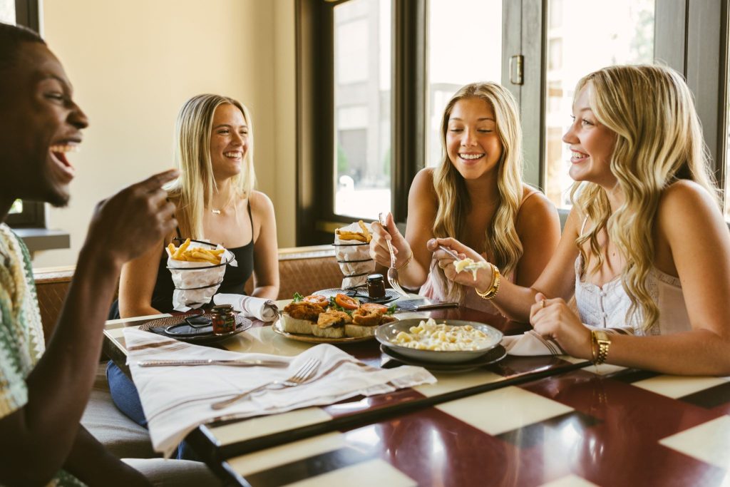 A group of friends sharing a meal at Texas A&M.